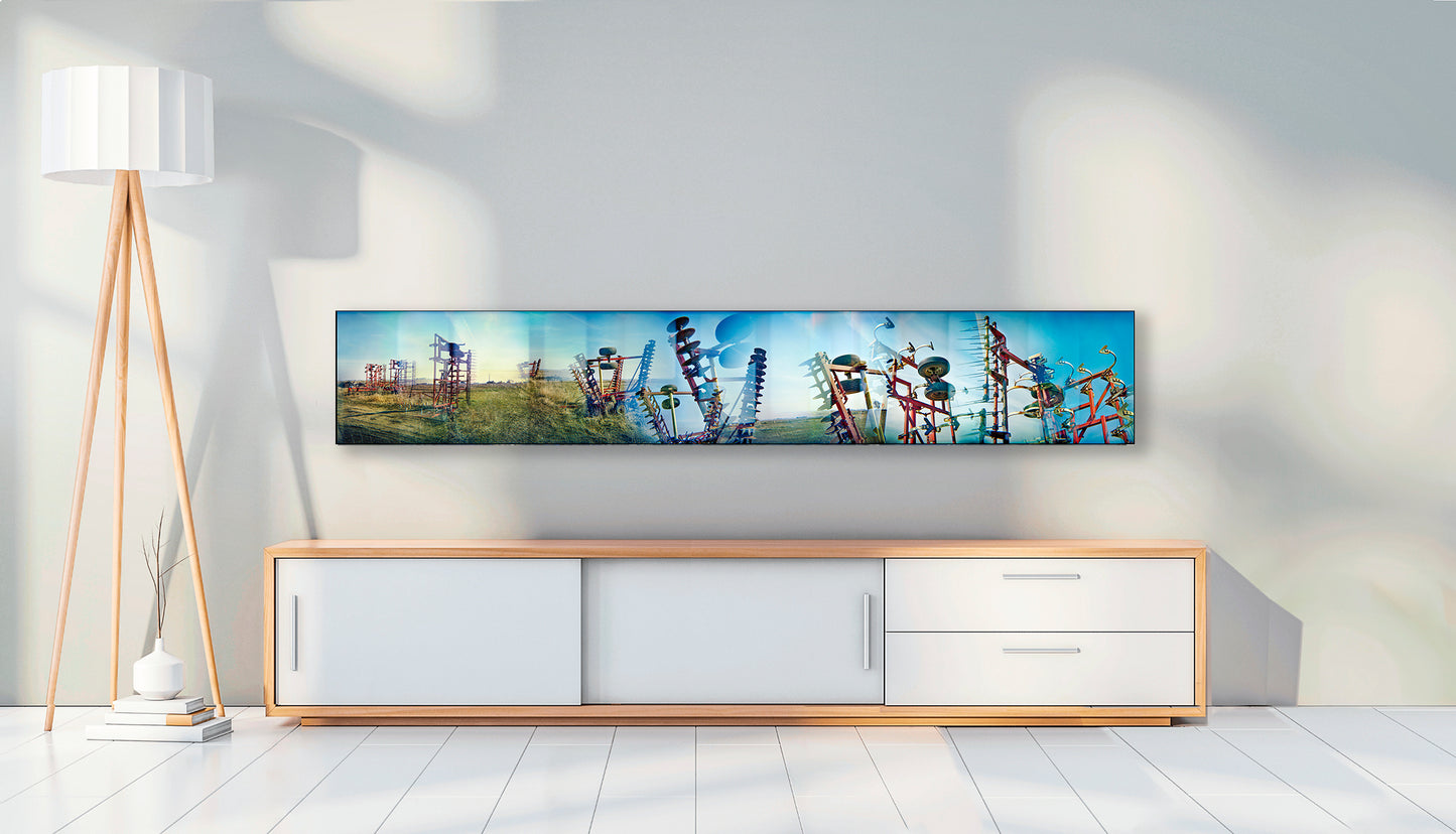 Overlapping multiple exposure shot on film of farm equipment silhouetted in sky