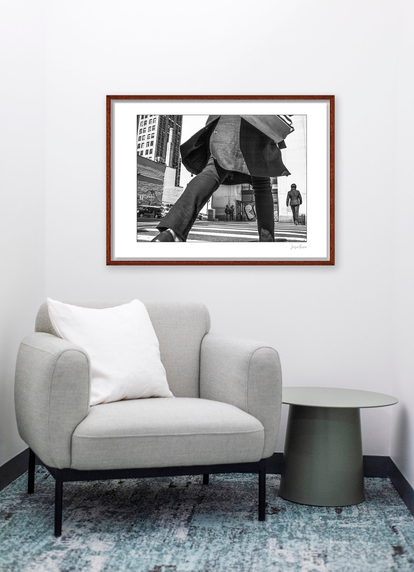 Black & White photograph of people walking in New York City with low perspective