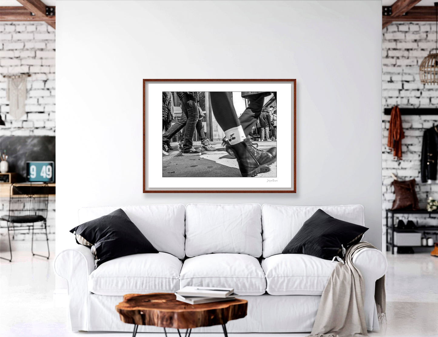 Black & White photograph of people walking in Times Square with low perspective