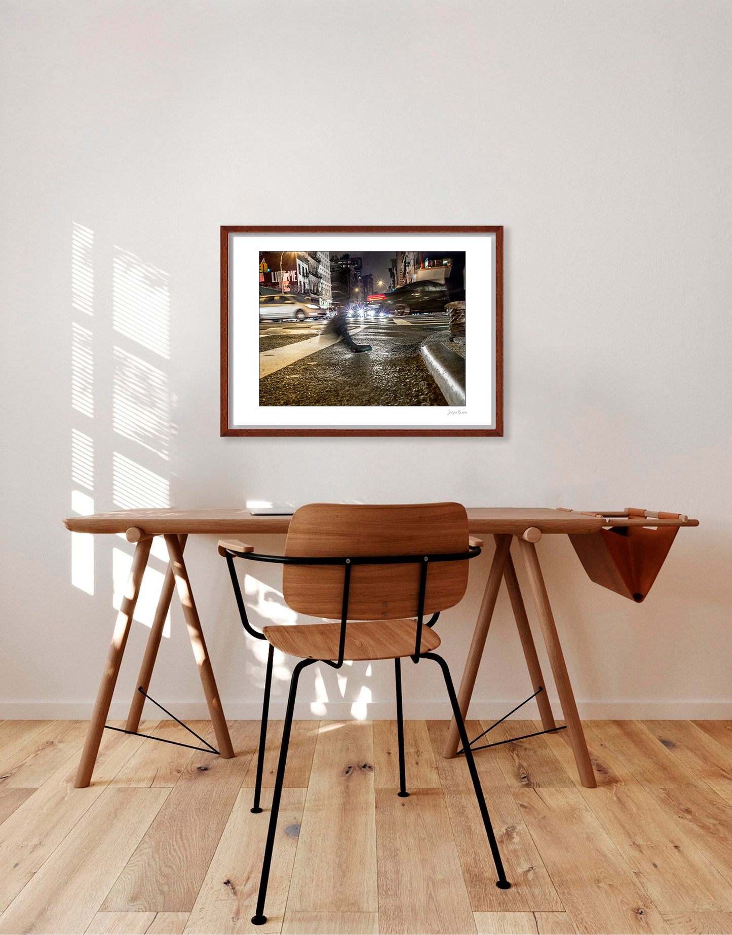 Photograph of a blurred foot crossing wet pavement in Chinatown at night in New York City with low perspective