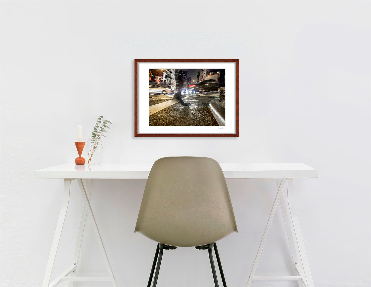 Photograph of a blurred foot crossing wet pavement in Chinatown at night in New York City with low perspective