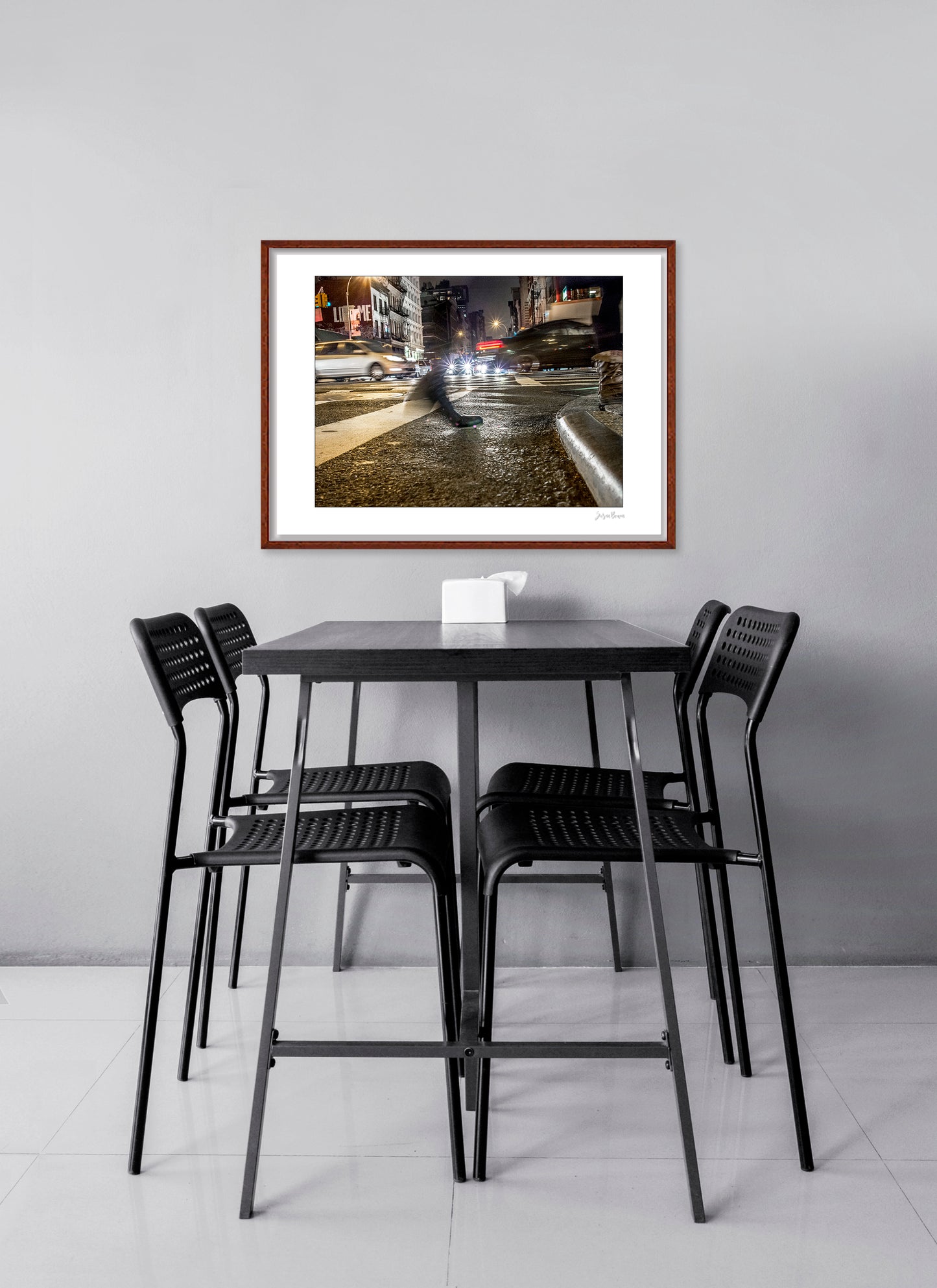 Photograph of a blurred foot crossing wet pavement in Chinatown at night in New York City with low perspective