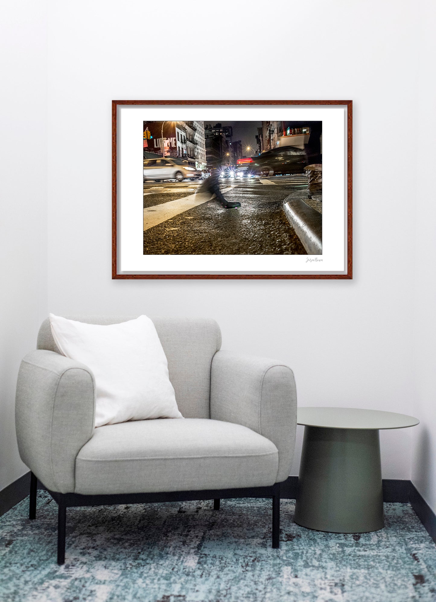 Photograph of a blurred foot crossing wet pavement in Chinatown at night in New York City with low perspective