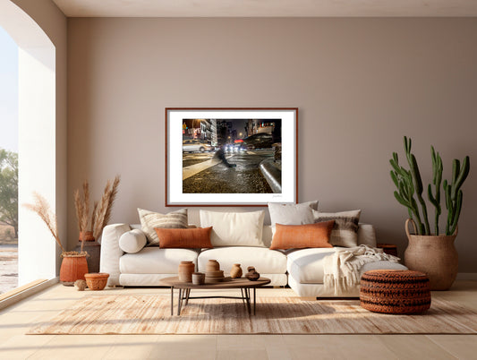 Photograph of a blurred foot crossing wet pavement in Chinatown at night in New York City with low perspective