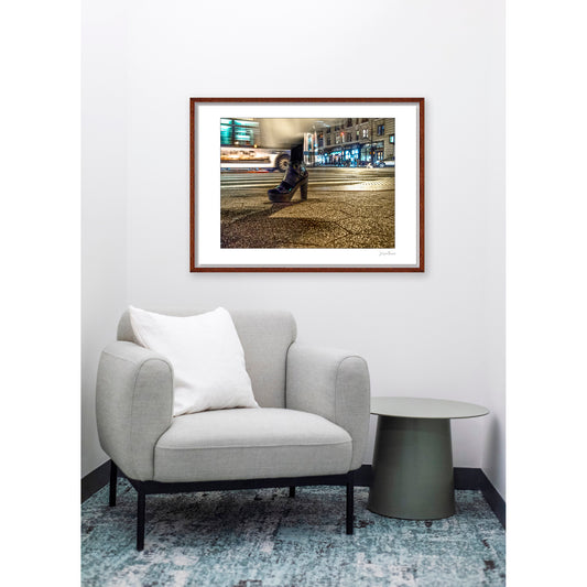 Photography of single foot with high heel and clothing in motion at night in New York City with low perspective