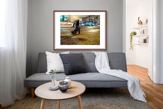 Photography of single foot with high heel and clothing in motion at night in New York City with low perspective