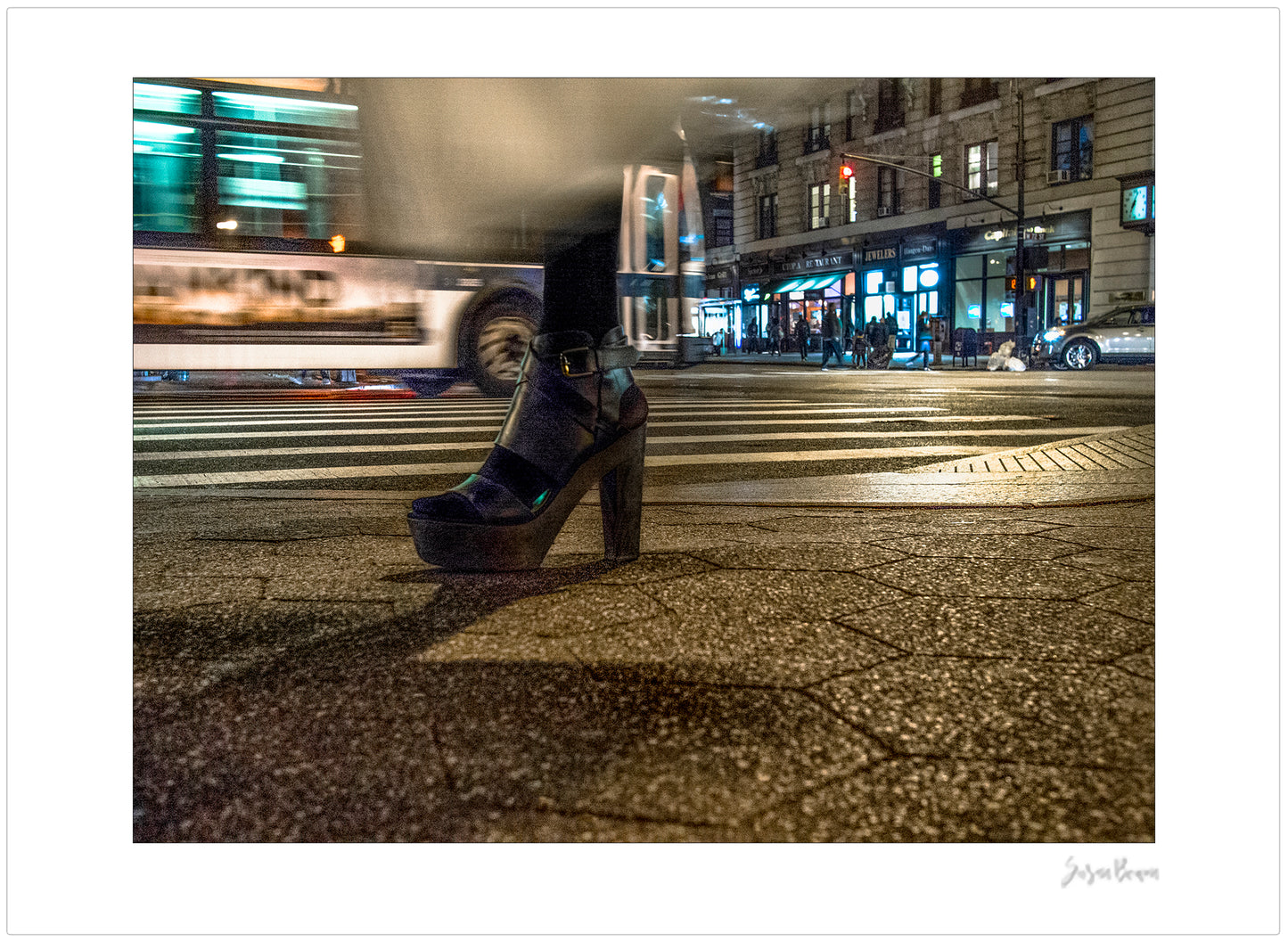 Photography of single foot with high heel and clothing in motion at night in New York City with low perspective