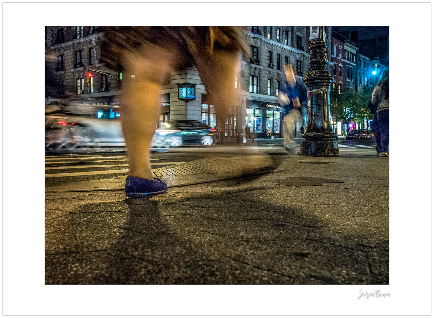 Photography of blurry swinging clothing and legs in New York City with low perspective