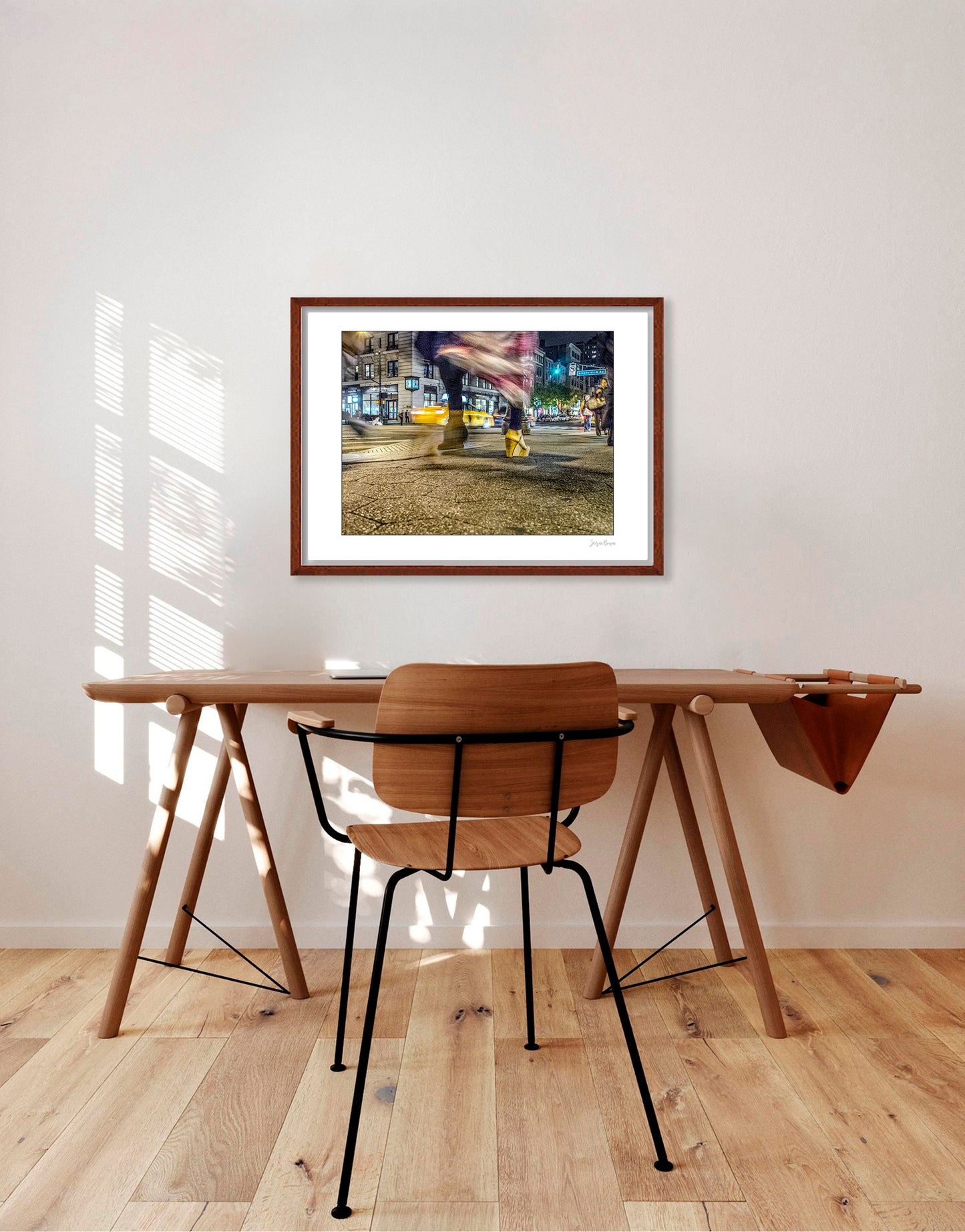 Photography of blurry swinging clothing and 2 mis-matched legs in New York City with low perspective
