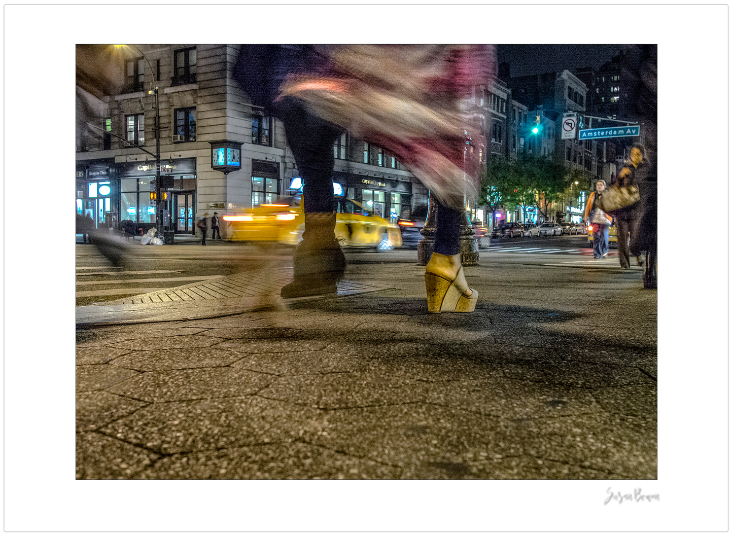 Photography of blurry swinging clothing and 2 mis-matched legs in New York City with low perspective