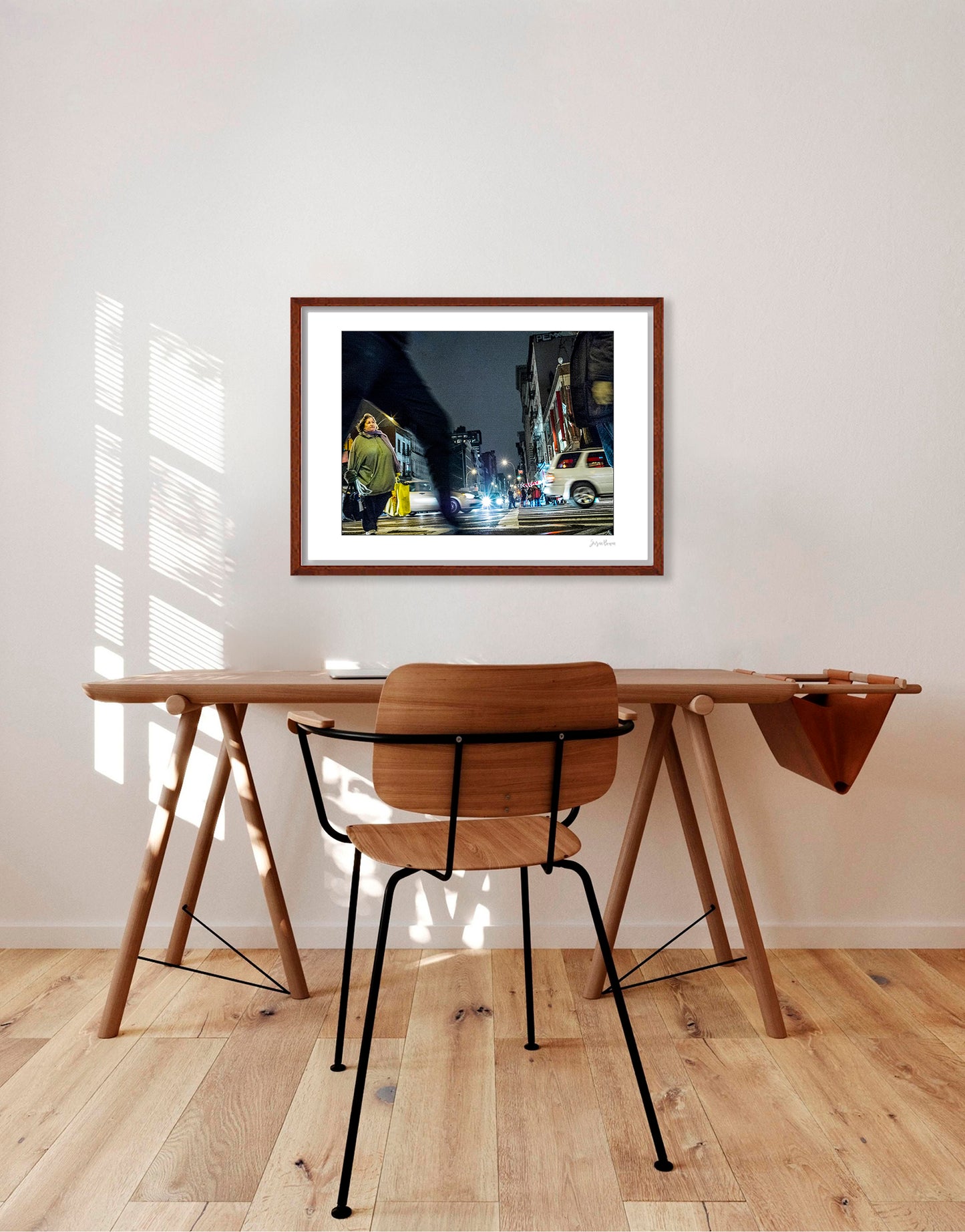Photograph of blurry leg and person crossing intersection in Chinatown in New York City with low perspective