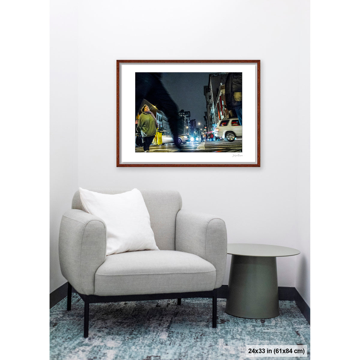 Arching Leg and Figure artwork by Susan Bowen, shown as 24x33 framed print. Features night street photograph of a woman standing still at a Canal Street intersection as blurred figures and traffic rush past.