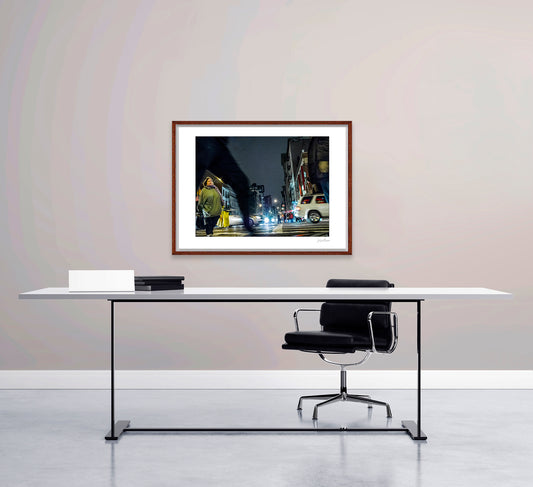 Photograph of blurry leg and person crossing intersection in Chinatown in New York City with low perspective