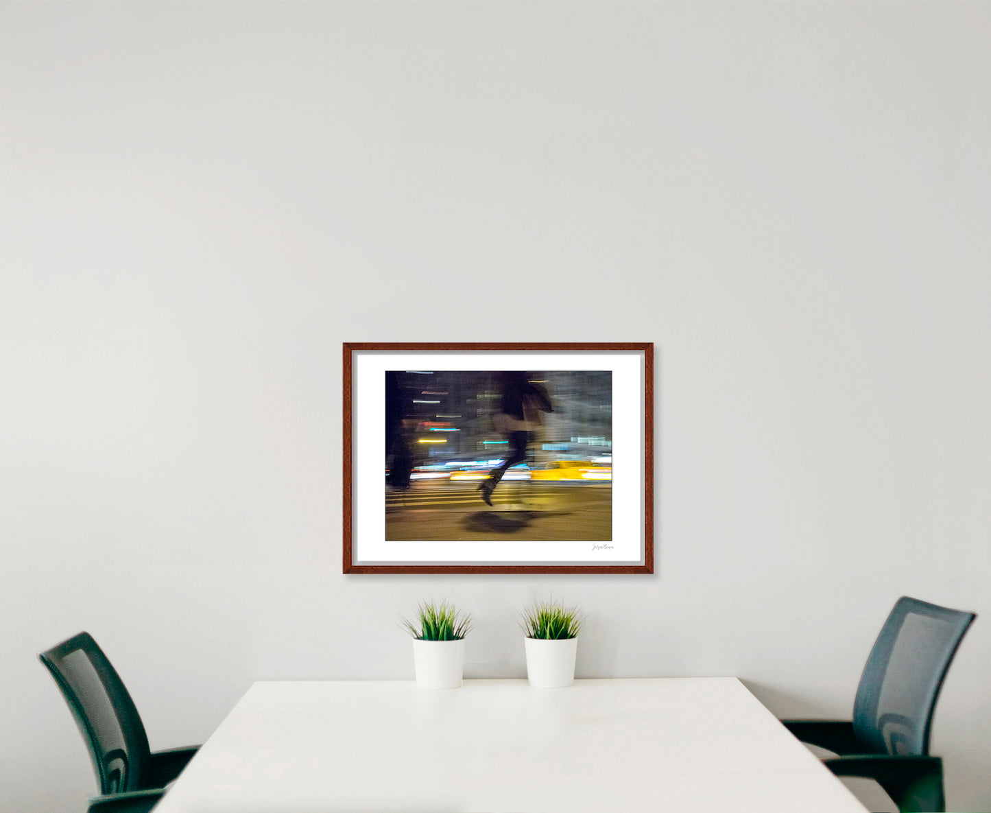 Photograph of person walking using panning technique lots of movement and color in New York City with low perspective