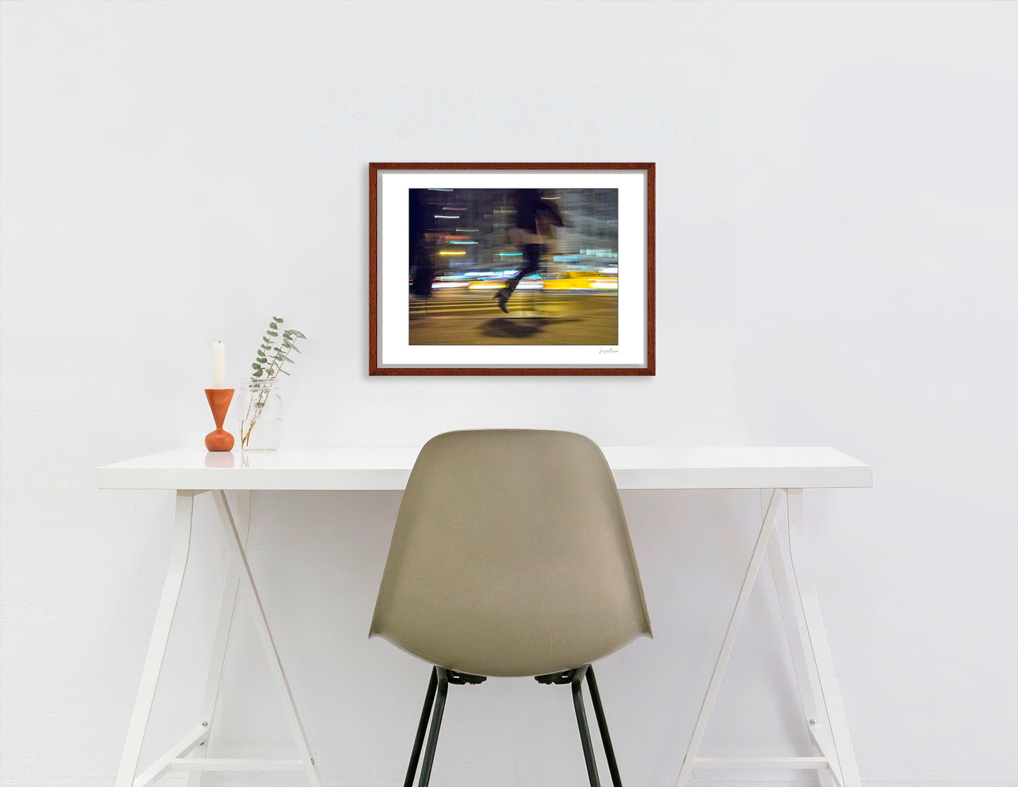Photograph of person walking using panning technique lots of movement and color in New York City with low perspective