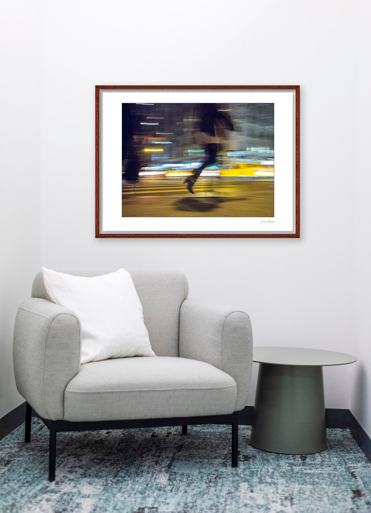 Photograph of person walking using panning technique lots of movement and color in New York City with low perspective