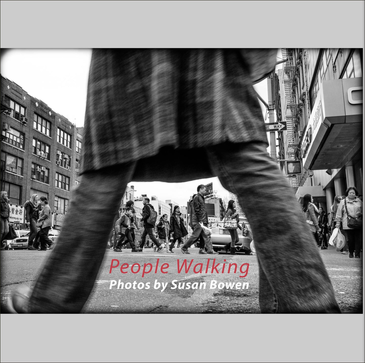Book of black & White photographs of people walking in New York City with low perspective