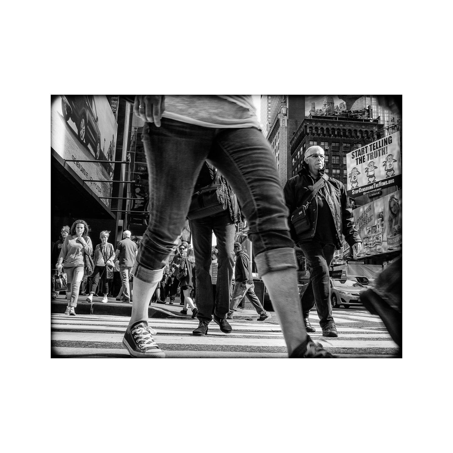 Book of black & White photographs of people walking in New York City with low perspective