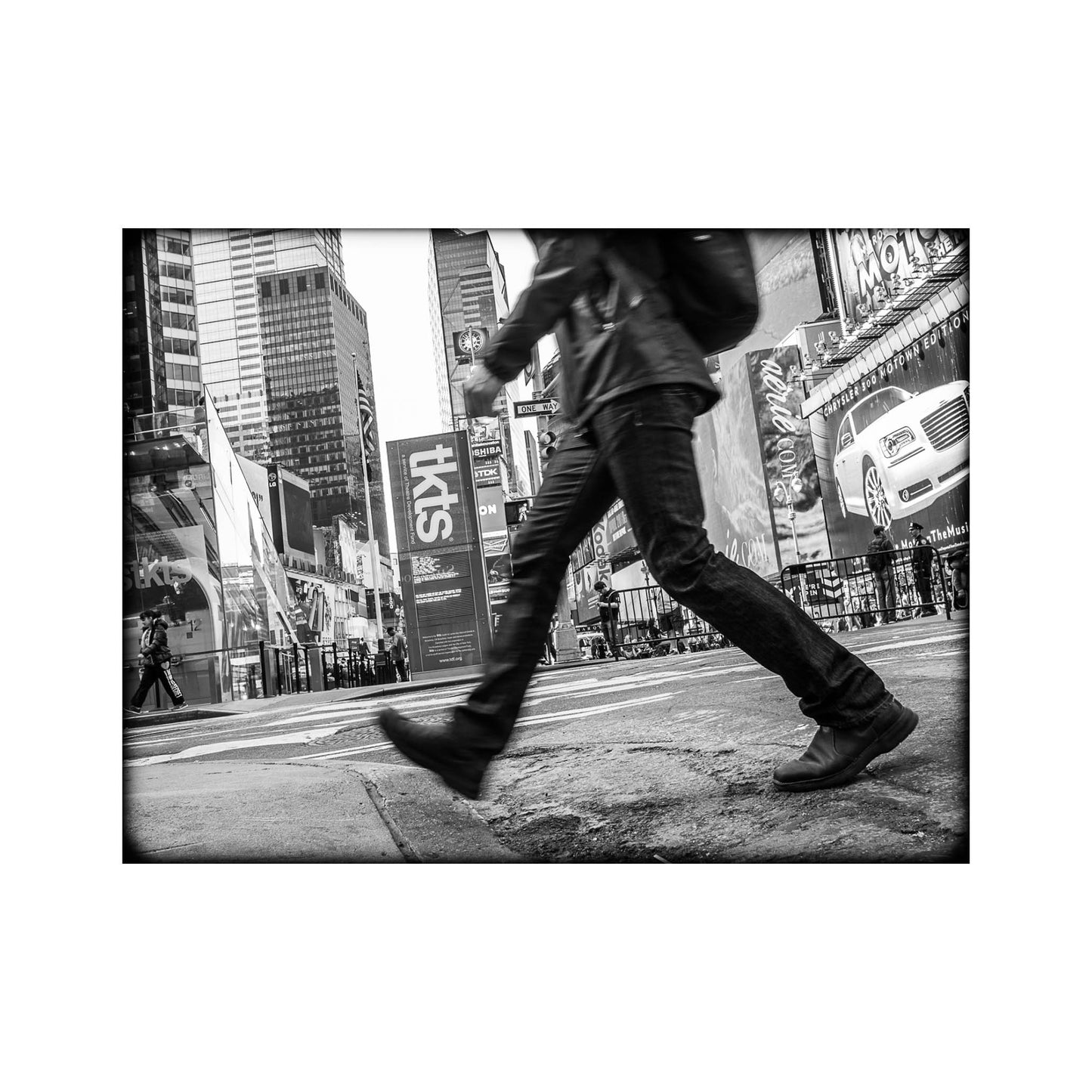 Book of black & White photographs of people walking in New York City with low perspective