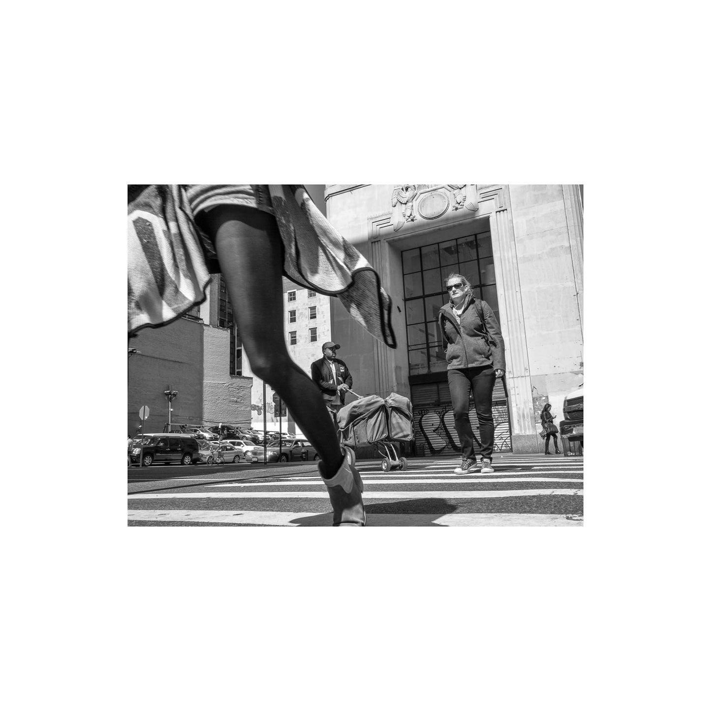 Book of black & White photographs of people walking in New York City with low perspective
