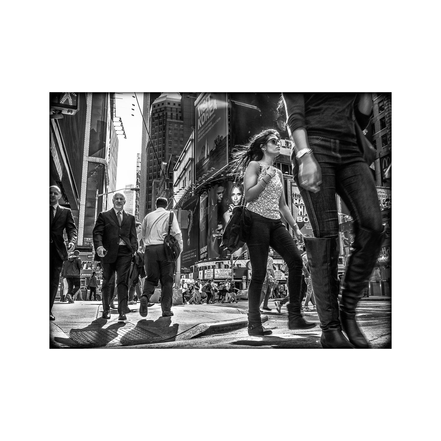 Book of black & White photographs of people walking in New York City with low perspective