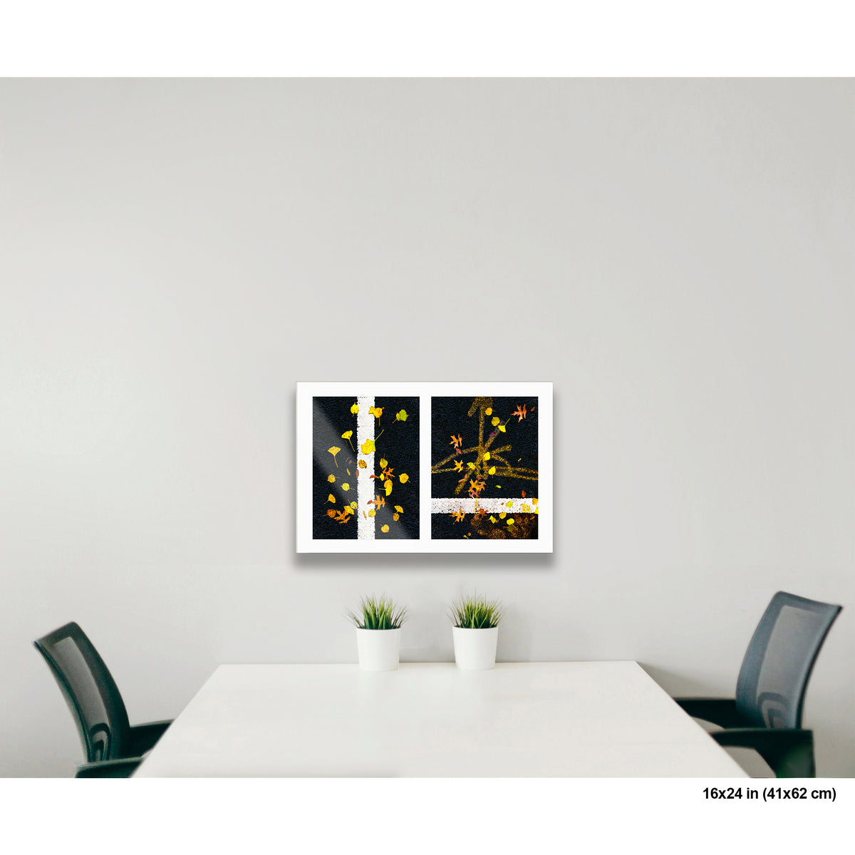 Scattered Leaves on Lines artwork by Susan Bowen, shown as 16x24 print. Features autumn leaves scattered across painted street lines capture nature and urban order in quiet contrast.