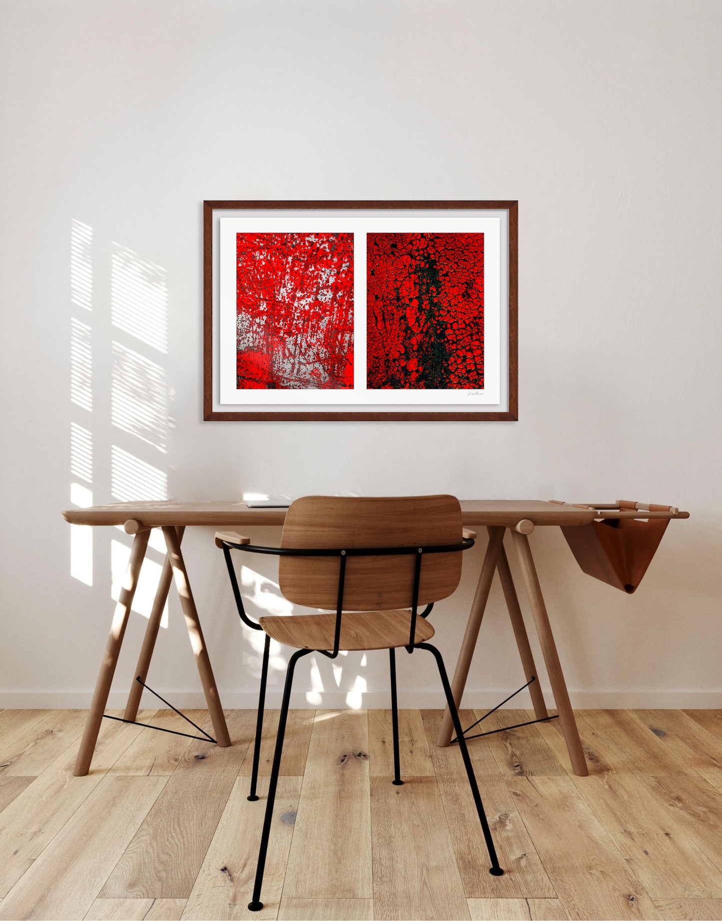 Abstract photographic diptych of highly textured surfaces in red, black, and white. Example of small framed print in a residential office.