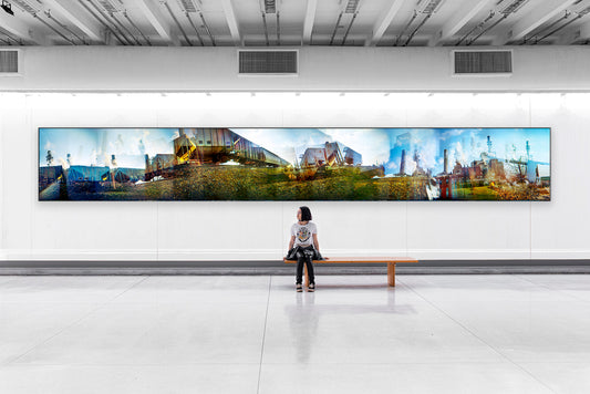 Overlapping multiple exposure shot on film of train approaching power plant