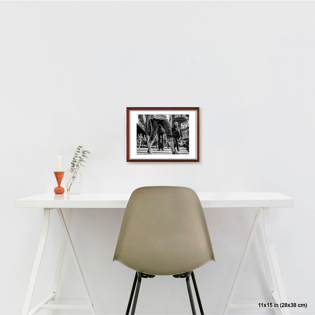 Times Square View Between Legs artwork by Susan Bowen, shown as 11x15 framed print. Features low-angle B&W street photograph of pedestrians mid-stride in Times Square, legs looming large against the city.
