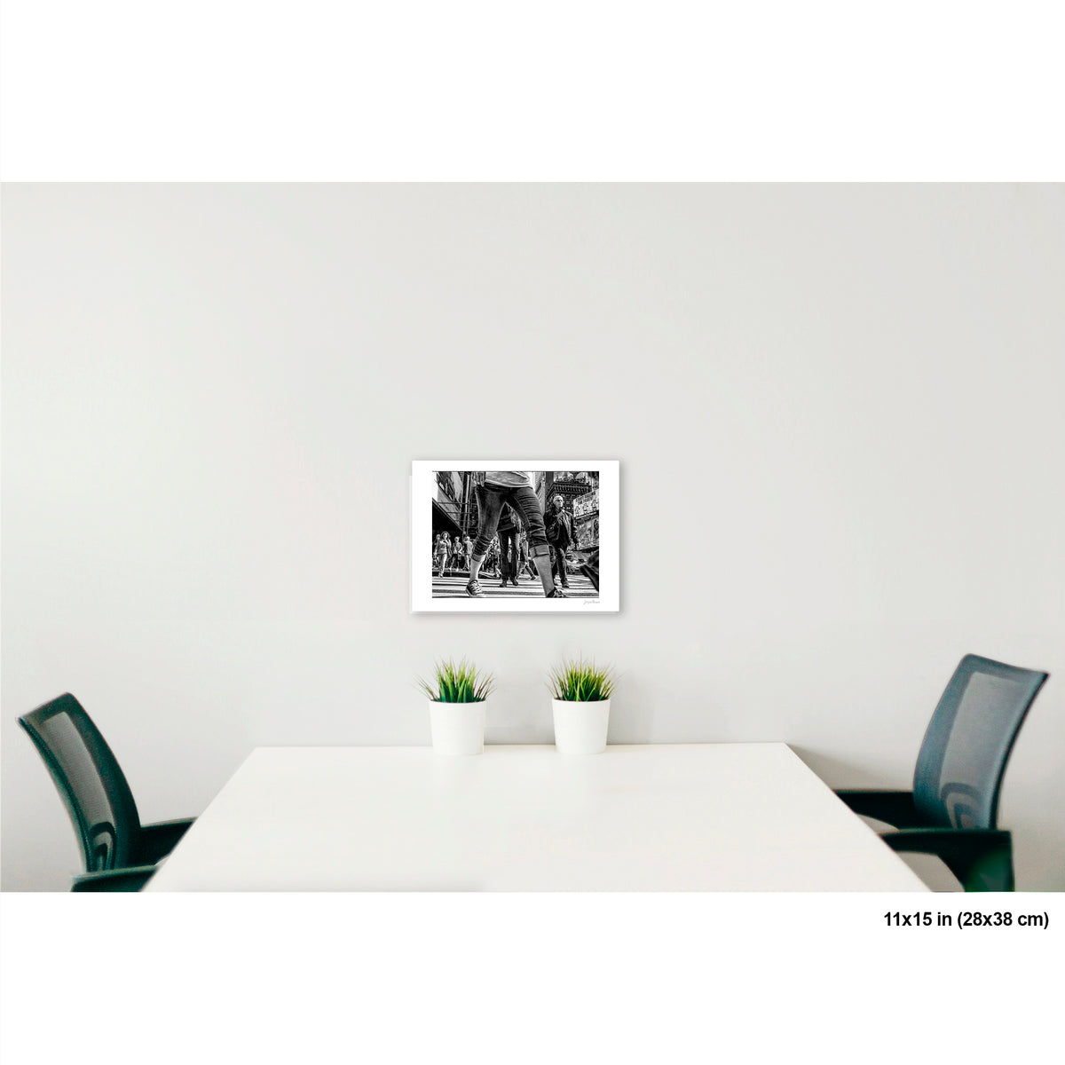 Times Square View Between Legs artwork by Susan Bowen, shown as 11x15 print. Features low-angle B&W street photograph of pedestrians mid-stride in Times Square, legs looming large against the city.