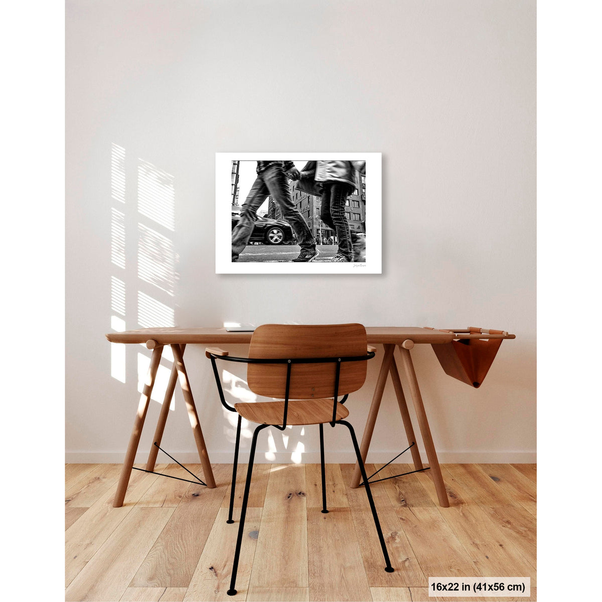 Couple in Chinatown artwork by Susan Bowen, shown as 16x22 print. Features low-angle B&W photograph of a couple crossing hand-in-hand through a Chinatown intersection, motion-blurred mid-stride.