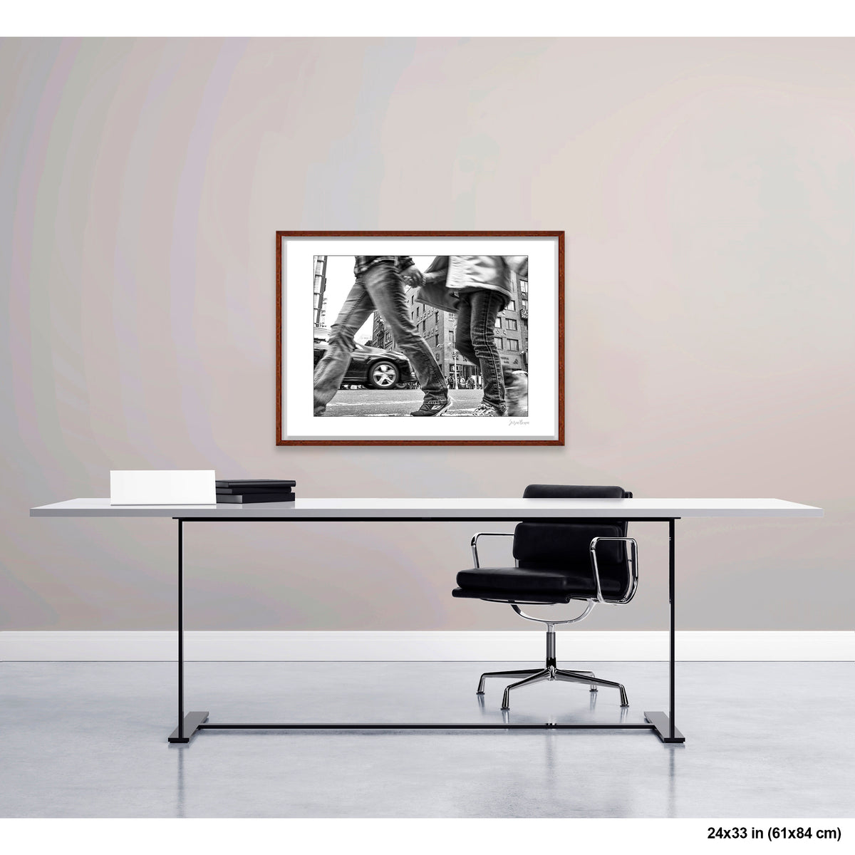 Couple in Chinatown artwork by Susan Bowen, shown as 24x33 framed print. Features B&W street photograph of a blurred stride crossing Times Square, boots and billboards in sharp contrast.
