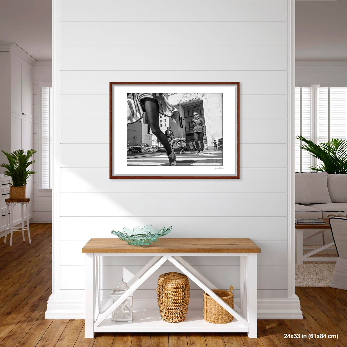 Canal Street, Waving Dress artwork by Susan Bowen, shown as 24X33 framed print. Features B&W low-angle photograph of a woman in a striped dress mid-stride on a Canal Street crosswalk, skirt in motion.