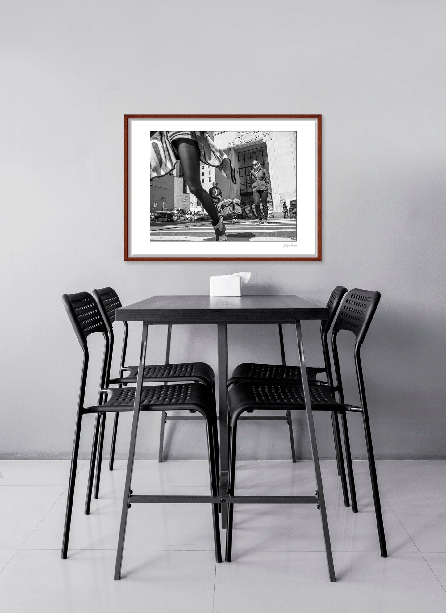 Black & White photograph of people walking in New York City with low perspective