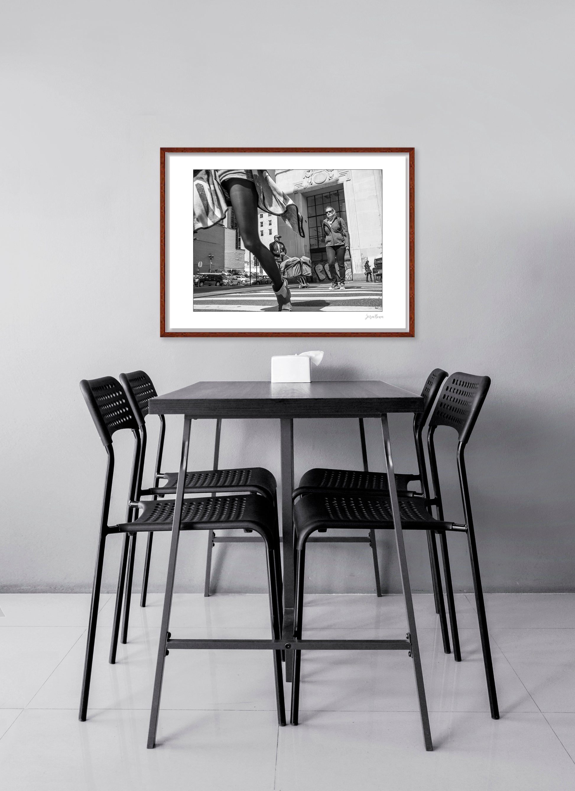 Black & White photograph of people walking in New York City with low perspective