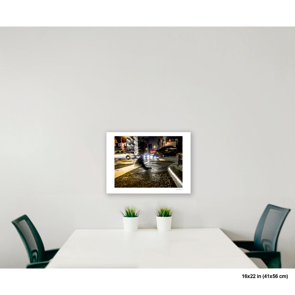 Foot Near Curb and Headlights artwork by Susan Bowen, shown as 16x22 print. Features long-exposure night photograph of a single shoe on a wet Canal Street crosswalk, surrounded by streaking headlights.