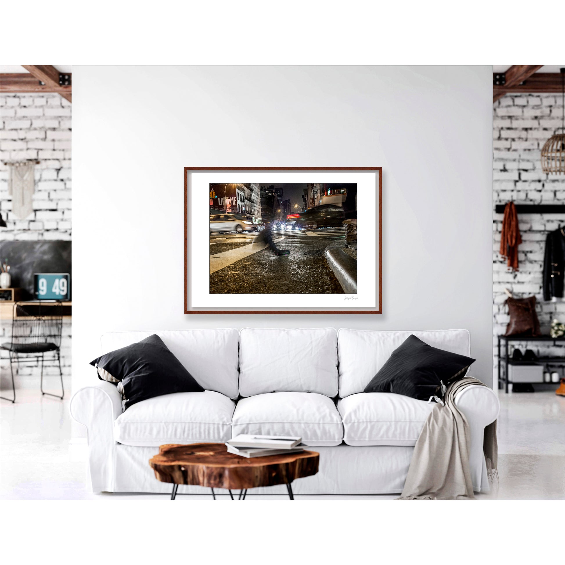 Photograph of a blurred foot crossing wet pavement in Chinatown at night in New York City with low perspective