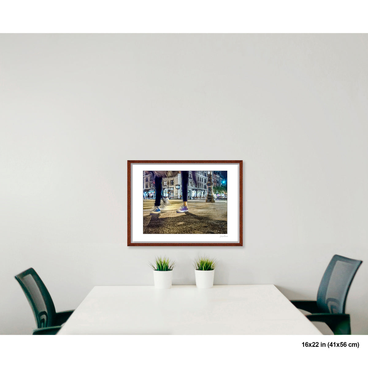 Mis-Matched Legs artwork by Susan Bowen, shown as 16x22 framed print. Features night photograph of two mismatched pairs of Converse sneakers at a lit NYC intersection, one still, one in motion.