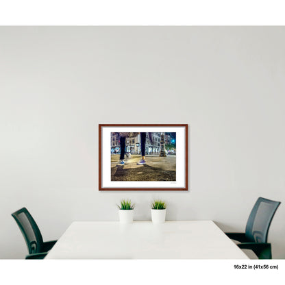 Mis-Matched Legs artwork by Susan Bowen, shown as 16x22 framed print. Features night photograph of two mismatched pairs of Converse sneakers at a lit NYC intersection, one still, one in motion.