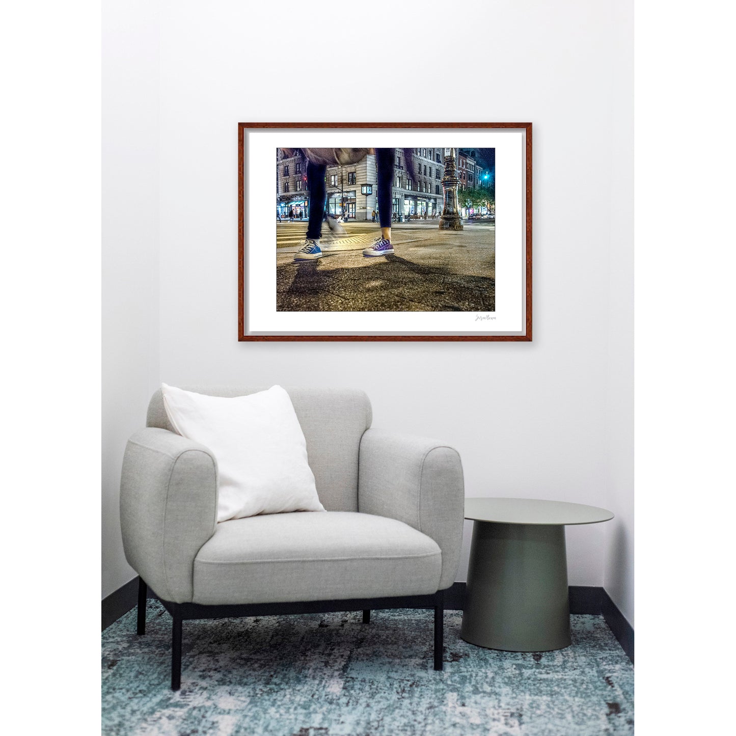 Photograph of two mis-matched legs of different people at night in New York City with low perspective