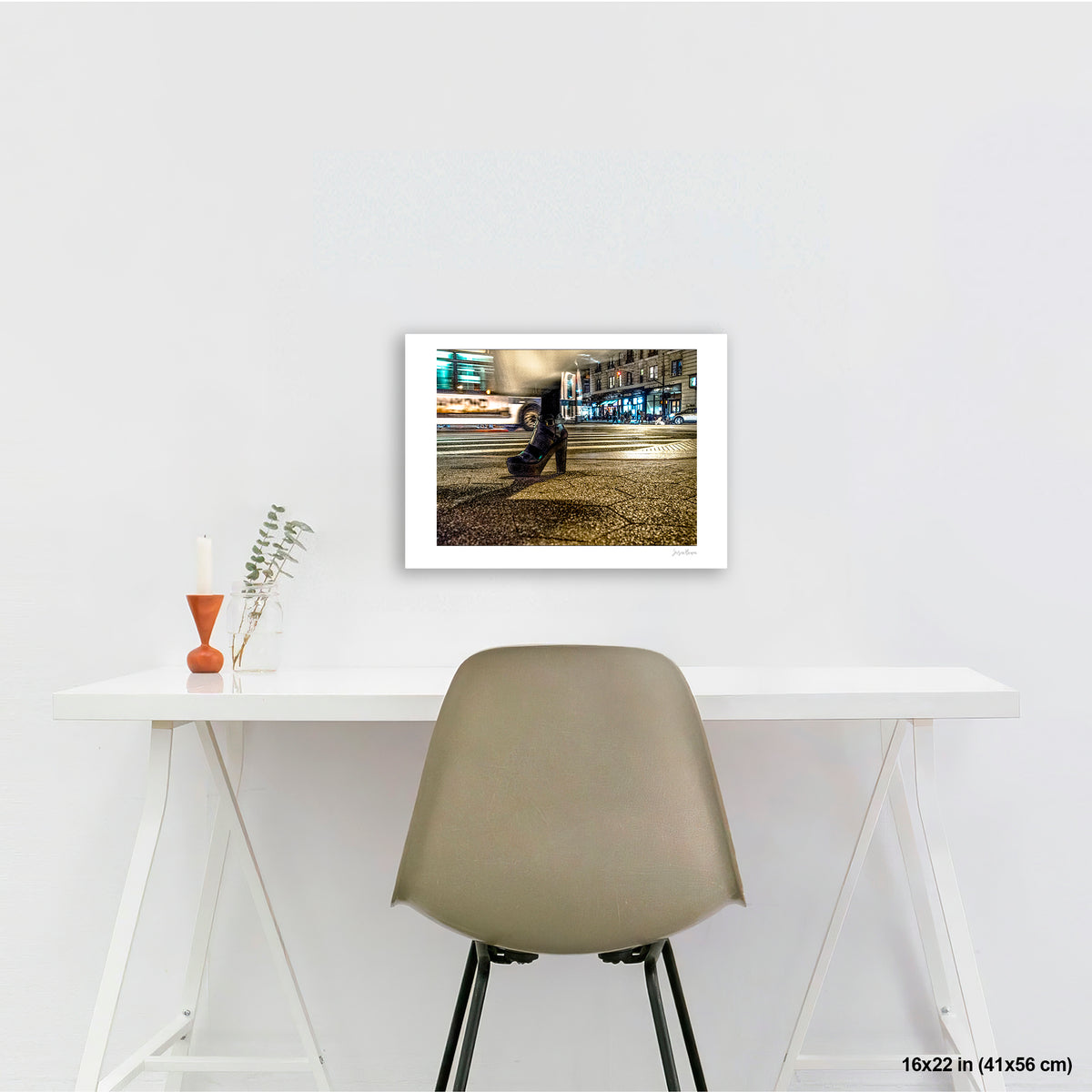 High-Heeled Shoe and Bus artwork by Susan Bowen, shown as 16x22 print. Features long-exposure night photograph of a single high-heeled shoe on a NYC crosswalk as a city bus streaks past behind it.
