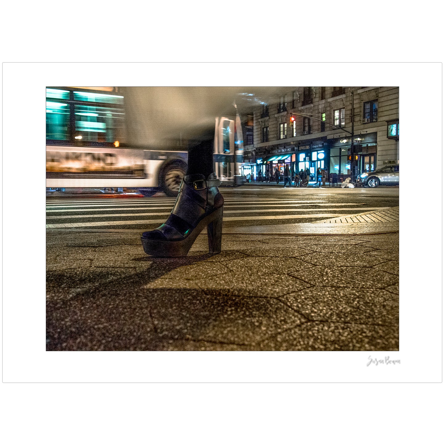 Photography of single foot with high heel and clothing in motion at night in New York City with low perspective