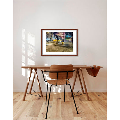 Photography of blurry swinging clothing and 2 mis-matched legs in New York City with low perspective