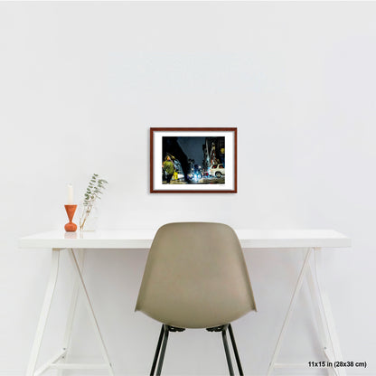 Arching Leg and Figure artwork by Susan Bowen, shown as 11x15 framed print. Features night street photograph of a woman standing still at a Canal Street intersection as blurred figures and traffic rush past.