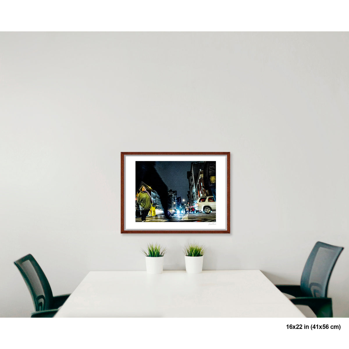 Arching Leg and Figure artwork by Susan Bowen, shown as 16x22 framed print. Features night street photograph of a woman standing still at a Canal Street intersection as blurred figures and traffic rush past.
