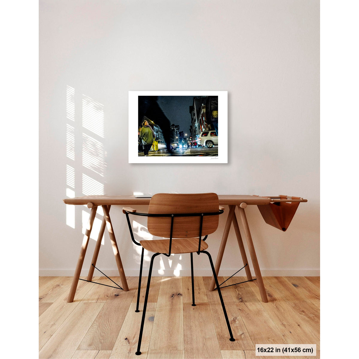 Arching Leg and Figure artwork by Susan Bowen, shown as 16x22 print. Features night street photograph of a woman standing still at a Canal Street intersection as blurred figures and traffic rush past.