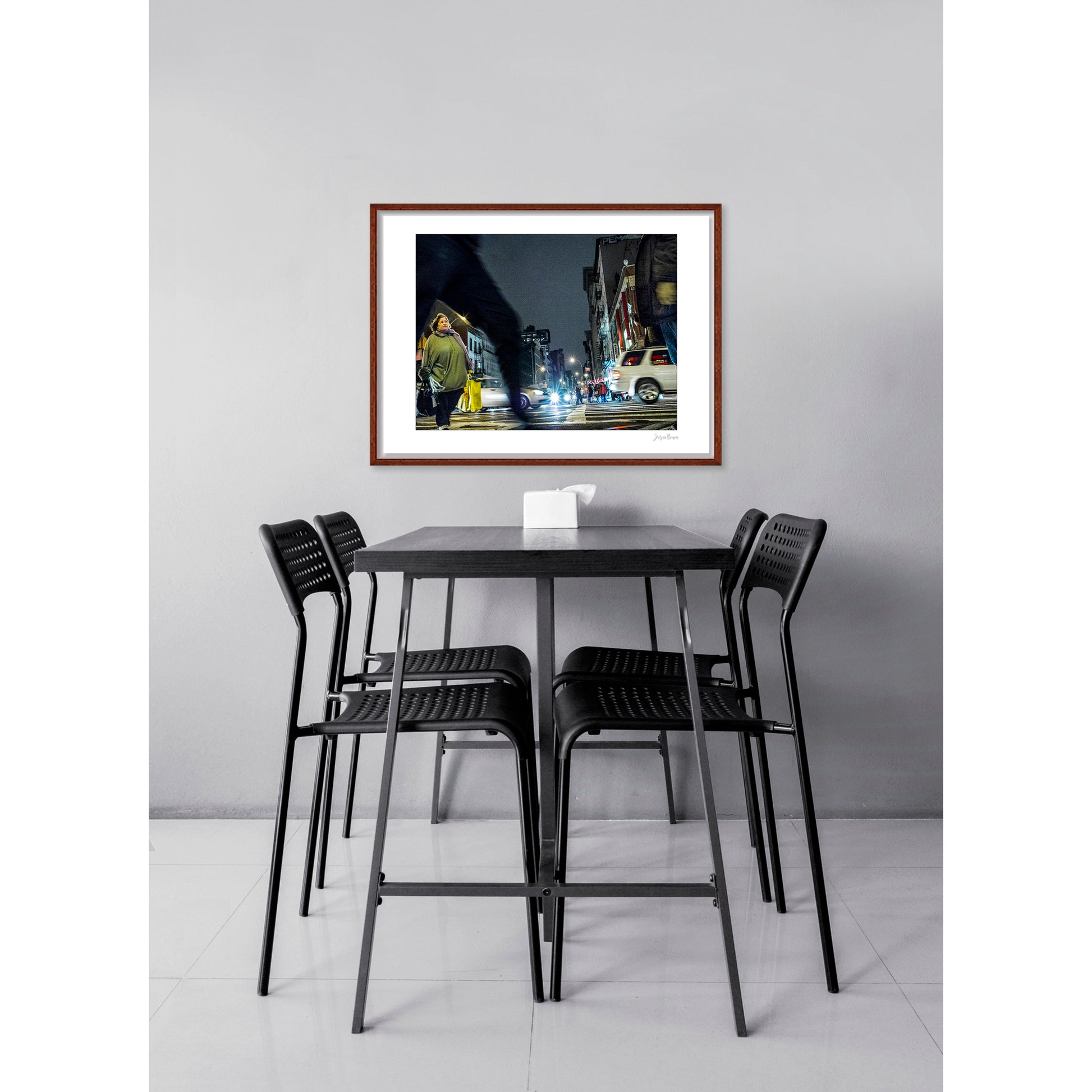 Photograph of blurry leg and person crossing intersection in Chinatown in New York City with low perspective