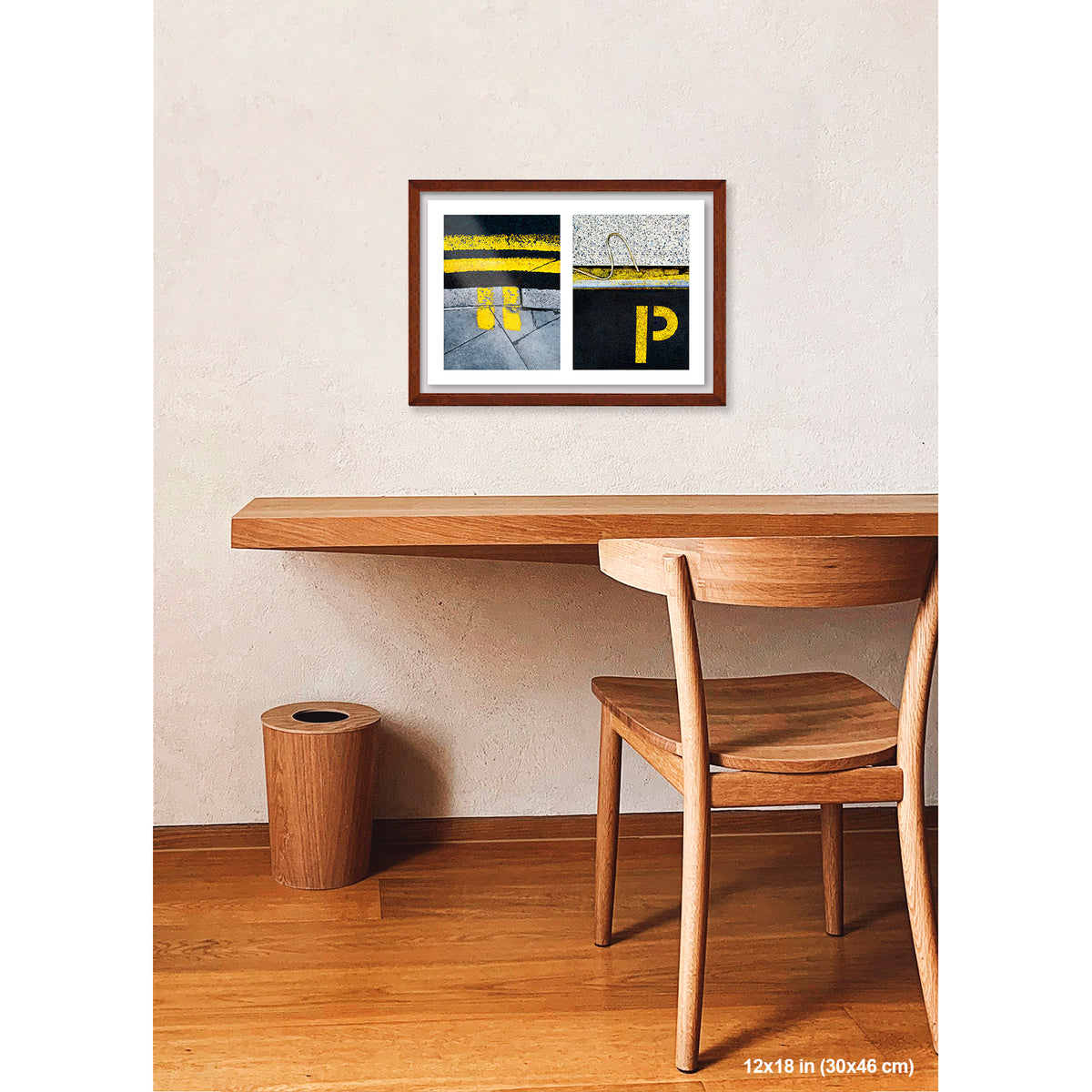 Yellow Markings and 'P' artwork by Susan Bowen, shown as 12x18 framed print. Features double yellow lines and a painted 'P' paired as bold, graphic urban street photography.
