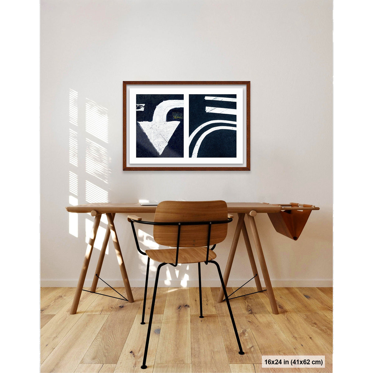 Arrow and Curved Line artwork by Susan Bowen, shown as 16x24 framed print. Features white arrow and sweeping road curves transformed into bold, high-contrast urban abstract photography.