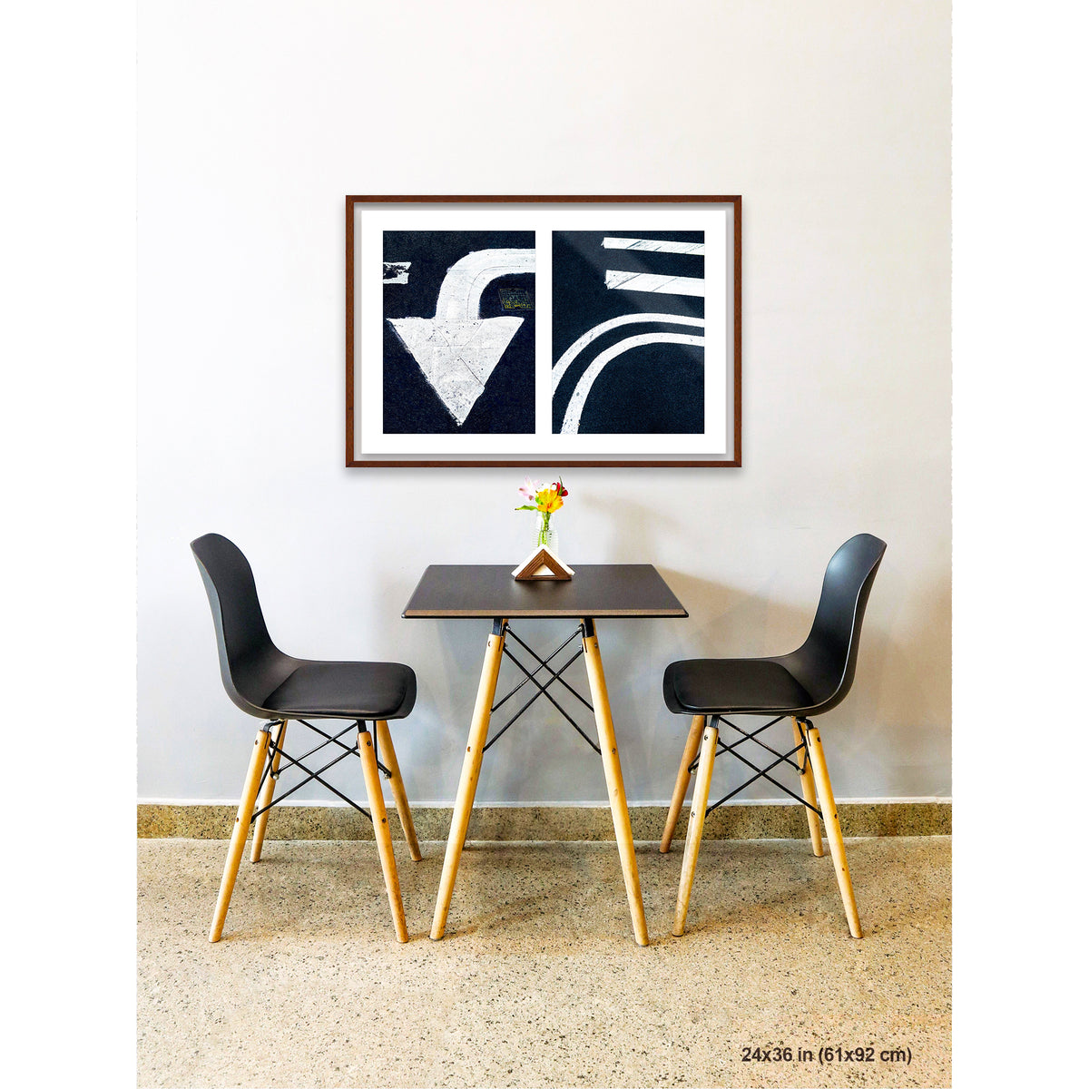 Arrow and Curved Line artwork by Susan Bowen, shown as 24x36 framed print. Features white arrow and sweeping road curves transformed into bold, high-contrast urban abstract photography.